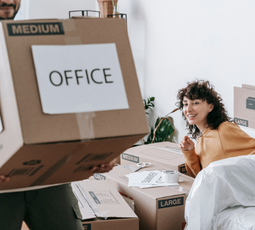 Office equipment and files being packed for relocation
